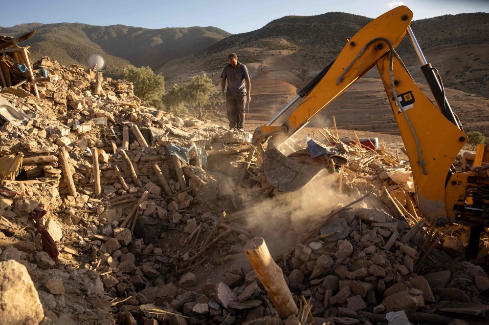 Rescue workers dig through rubble after an earthquake in the mountain village of Tafeghaghte, southwest of the city of Marrakesh, on September 9, 2023. — AFP pic