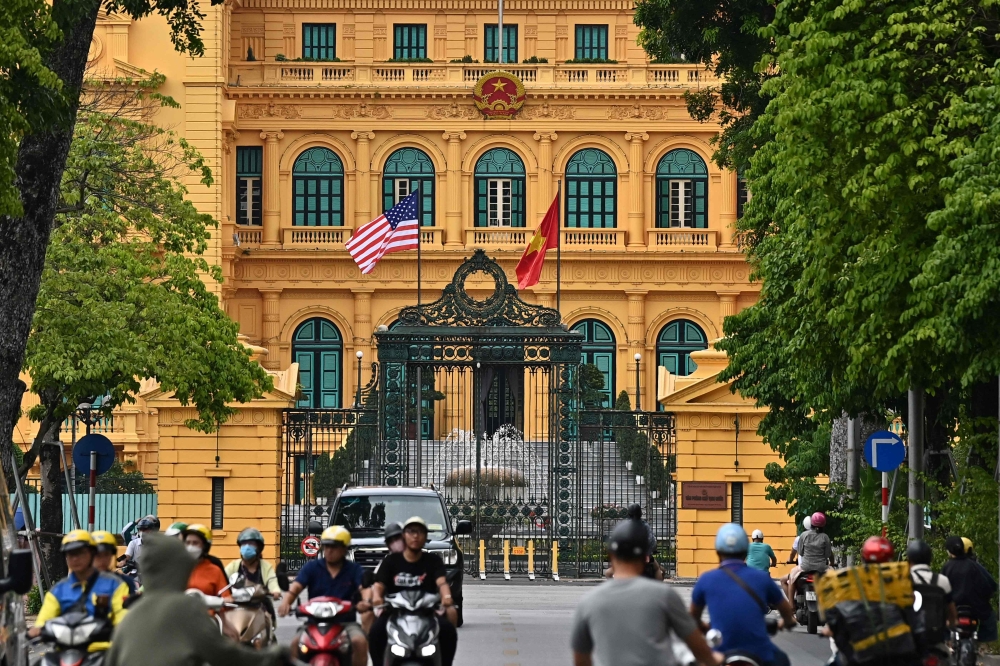 The US national flag flies next to Vietnam's flag at the Presidential Palace in Hanoi on September 9, 2023, a day before US President Joe Biden's visit to Vietnam. — AFP pic