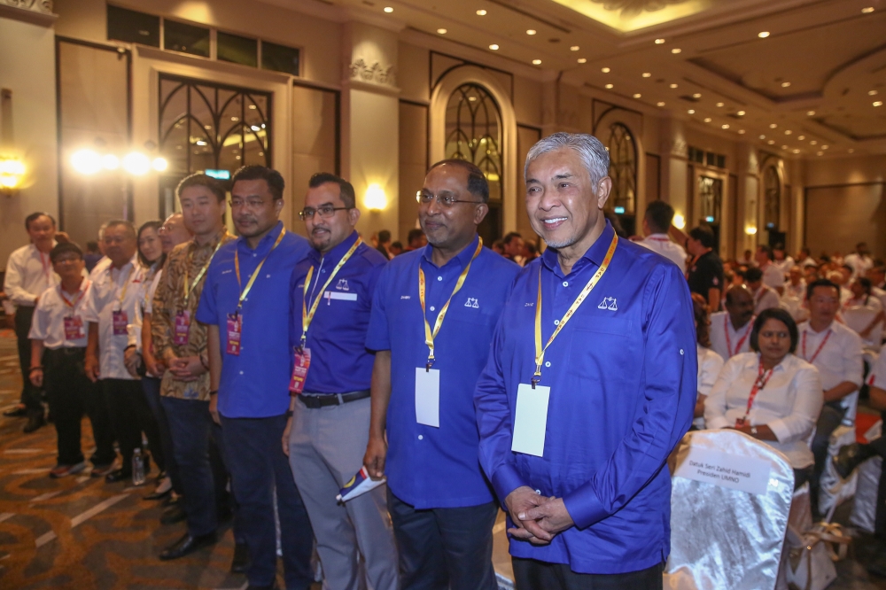 Umno president Datuk Seri Ahmad Zahid Hamidi with Umno secretary-general Datuk Asyraf Wajdi Dusuki and BN secretary-general Datuk Seri Zambry Abdul Kadir attend the DAP National Congress at Marriot Hotel in Putrajaya September 10, 2023. — Picture by Yusof Mat Isa