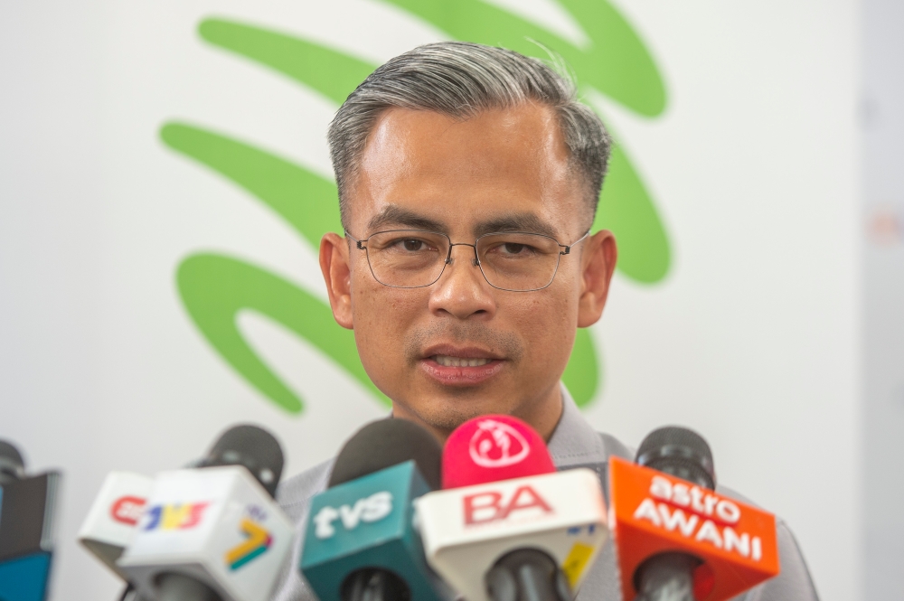 Communications and Digital Minister Fahmi Fadzil said all telcos in the country will sign a share subscription agreement on equity stakes in Digital Nasional Bhd in the near future. — Picture by Shafwan Zaidon