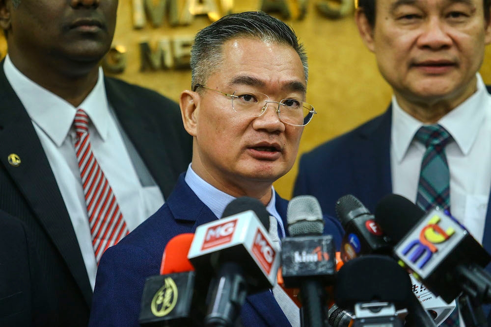 Kota Melaka MP Khoo Poay Tiong has accused MyEG of collecting money for foreign worker permit renewals when in actuality the company had been suspended from conducting business since February of this year. — Picture by Hari Anggara