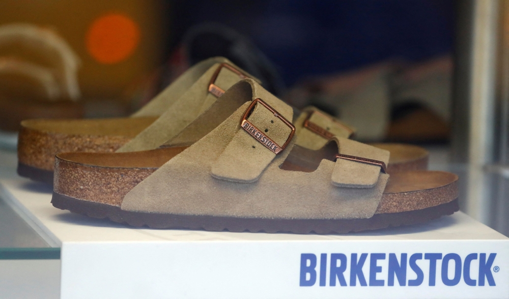 A pair of shoes is pictured in a window of a Birkenstock footwear store in Berlin January 21, 2021. — Reuters pic