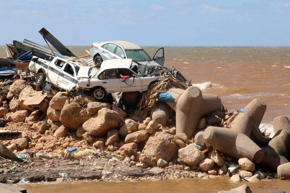 The floodwaters uprooted trees and hurled vehicles onto the port’s breakwaters. — AFP pic
