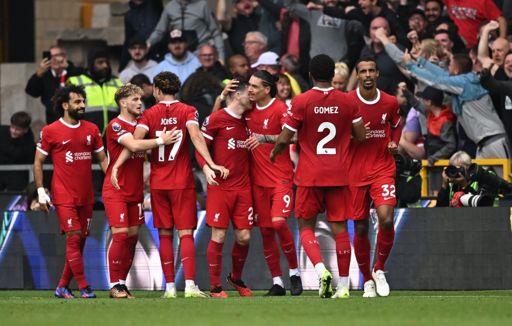 Liverpool’s Andrew Robertson celebrates scoring their second goal with teammates during the match against Wolverhampton Wanderers at the Molineux Stadium in Wolverhampton, September 16, 2023. — Reuters pic