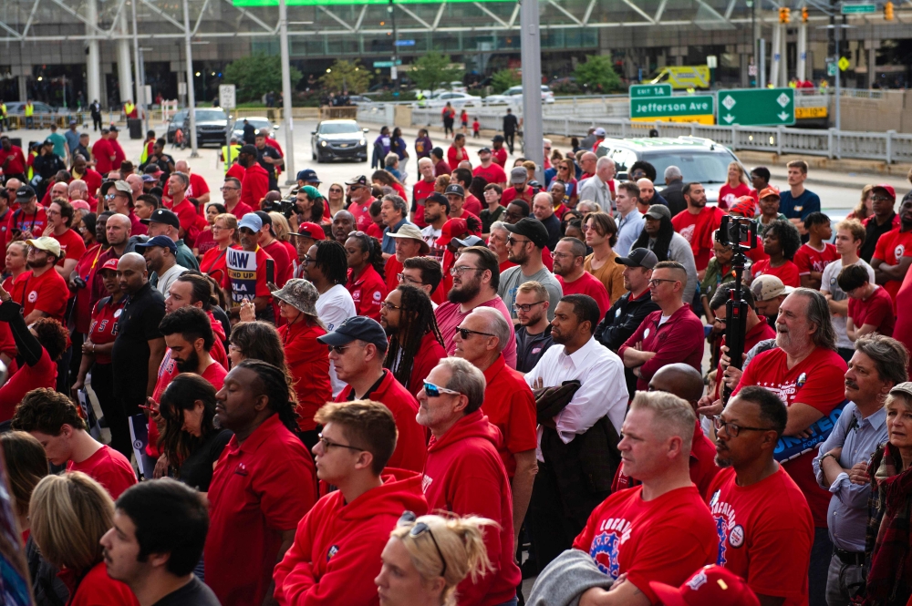 Members of the United Auto Workers union march through the streets of downtown Detroit following a rally on the first day of the UAW strike in Detroit, Michigan, on September 15, 2023. — AFP pic