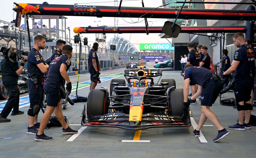 Red Bull's Sergio Perez in the pits during practice. — Reuters pic