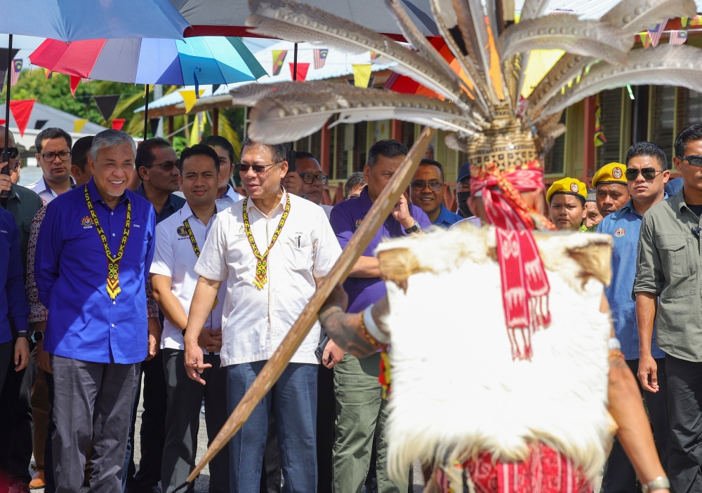 Deputy Prime Minister Datuk Seri Ahmad Zahid Hamidi being greeted at the Santuni Rakyat programme at Sekolah Kebangsaaan Haji Bujang, Sebangan in Samarahan September 17, 2023. — Bernama pic