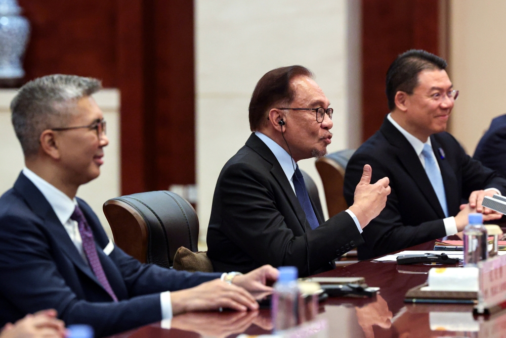 Prime Minister Datuk Seri Anwar Ibrahim at a meeting with Chinese premier Li Qiang after attending the Caexpo in Nanning, September 23, 2023. With him is Miti minister Tengku Datuk Seri Zafrul Abdul Aziz. — Bernama pic