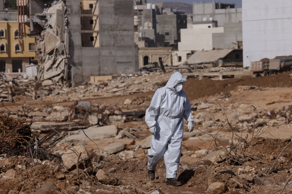 A rescuer walks amid the rubble of destroyed buildings, in the aftermath of the deadly storm that hit Libya,  in Derna, Libya September 17, 2023. — Reuters pic