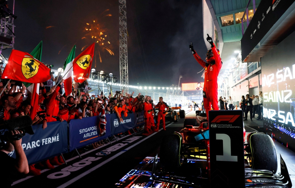 Ferrari’s Carlos Sainz Jr celebrates after winning the Singapore Grand Prix at Marina Bay Street Circuit, Singapore, September 17, 2023. — Reuters pic 