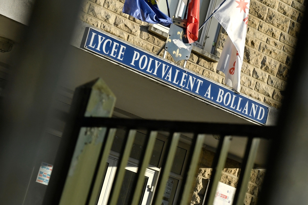 This photograph shows the entrance of the Adrienne Bolland high school in Poissy, Paris' suburb, on September 7, 2023, a day after one of its students killed himself at home after suffering from bullying at school. — AFP pic