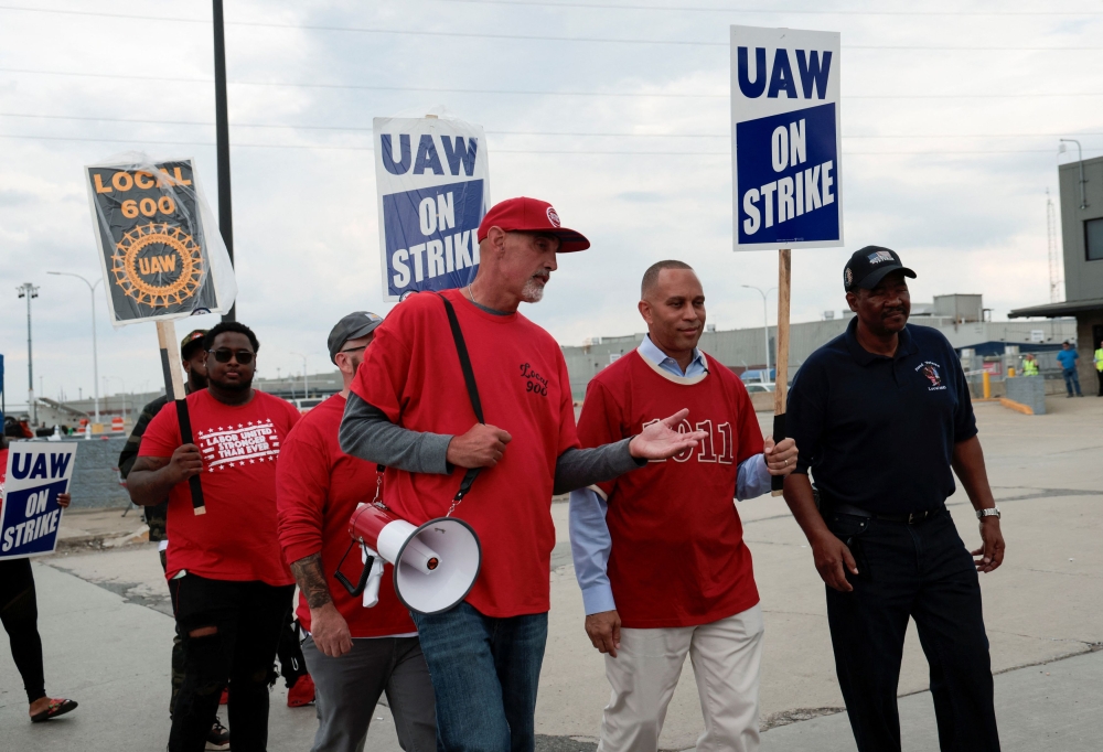 Hakeem Jeffries, Democratic Minority Leader of the U.S. House of Representatives, walks the picket line with striking United Auto Workers members outside the Ford Motor Michigan Assembly Plant in Wayne, Michigan September 17, 2023. — Reuters pic