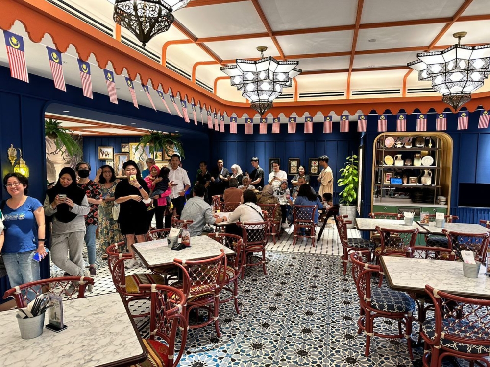 Many came out to buy Cafe Chef Wan’s premium curry puffs at a special Malaysia Day price. — Picture courtesy of Cafe Chef Wan
