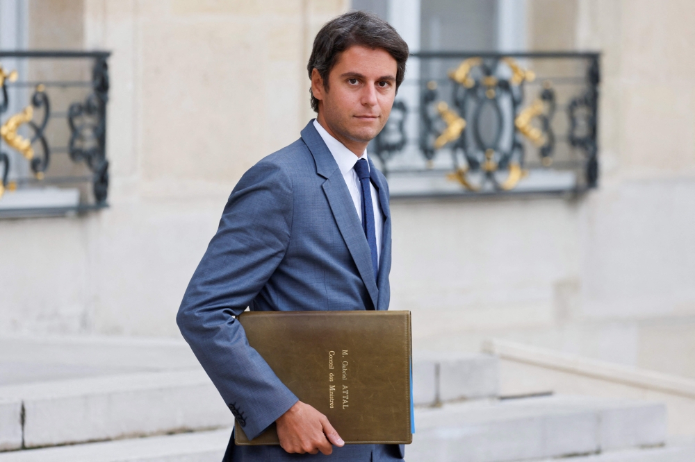 French Education and Youth Minister Gabriel Attal leaves after the weekly cabinet meeting at the Elysee Presidential Palace in Paris September 13, 2023. — AFP pic