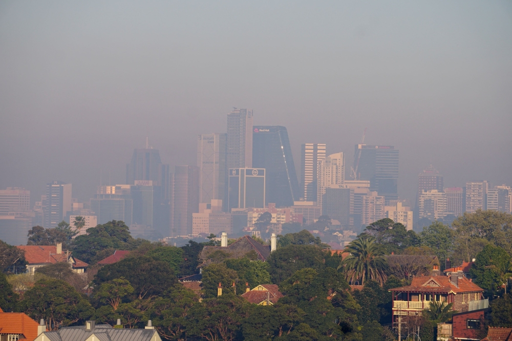 Smoke from backburning of the bush by authorities ahead of the summer bushfire season shrouds the skyline of Sydney. — Reuters pic