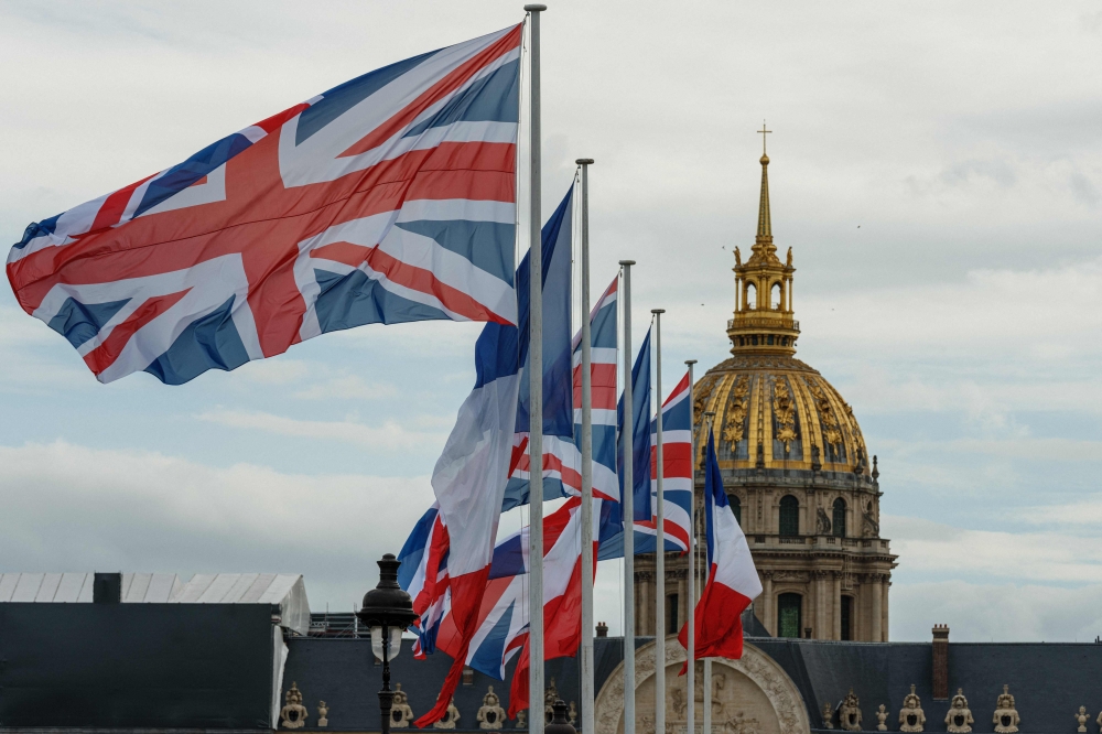 King Charles will arrive in France today for a three-day state visit, during which he and President Emmanuel Macron will hope to build on personal bonds to help turn the page on years of rocky relations between the two neighbouring countries. — AFP pic