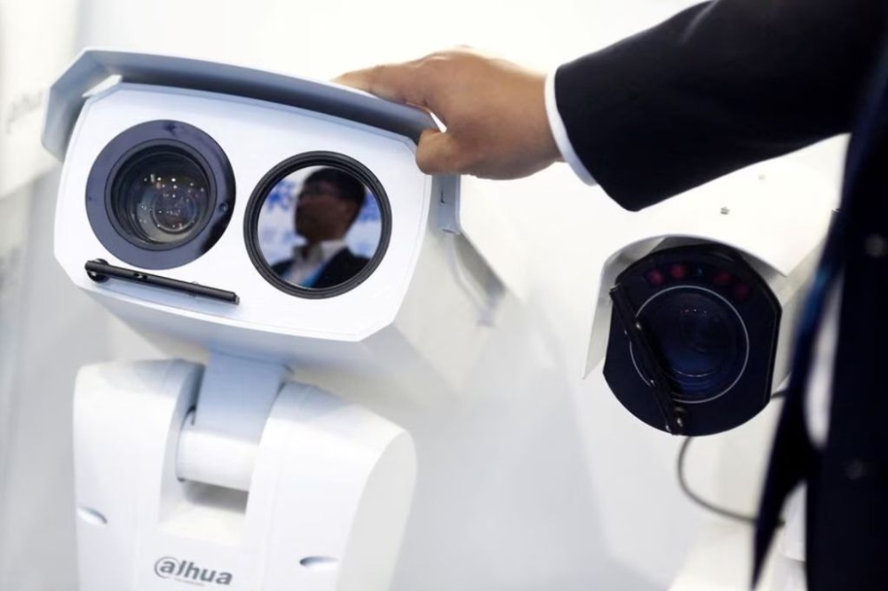 A man adjusts a CCTV camera at the stall of the video surveillance product maker Dahua Technology at the Security China 2018 exhibition on public safety and security in Beijing, China October 23, 2018. — Reuters pic