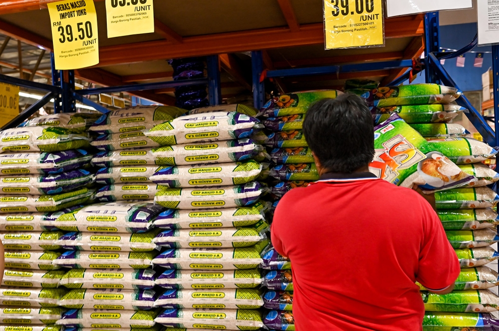 Packets of imported rice sold at the supermarket in Kuala Lumpur on September 19, 2023. — Picture by Miera Zulyana