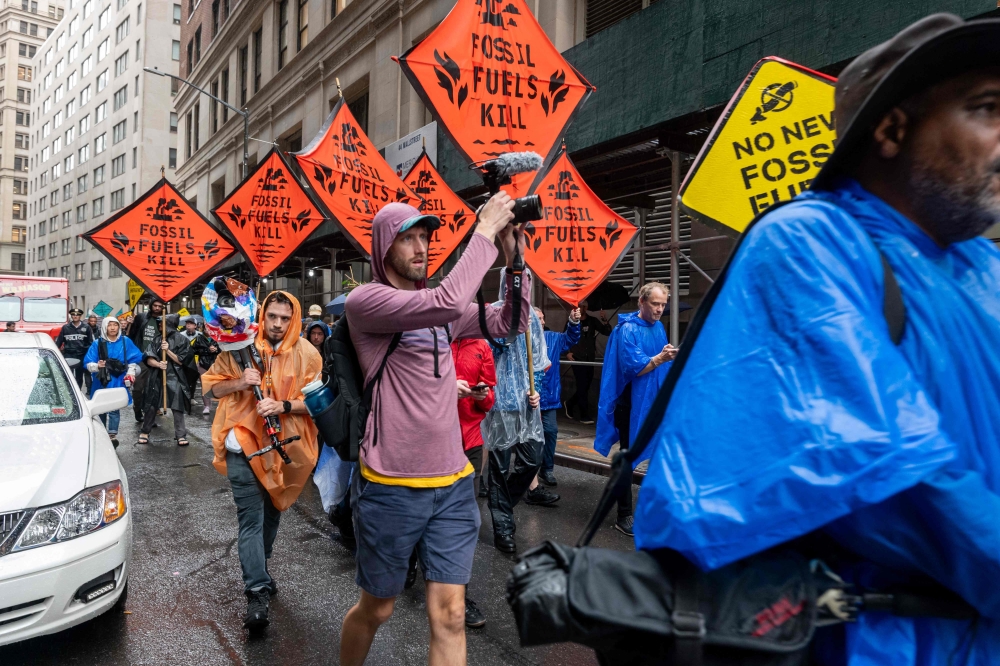 A demonstration being held in New York during the United Nations Climate Ambition Summit. — AFP pic