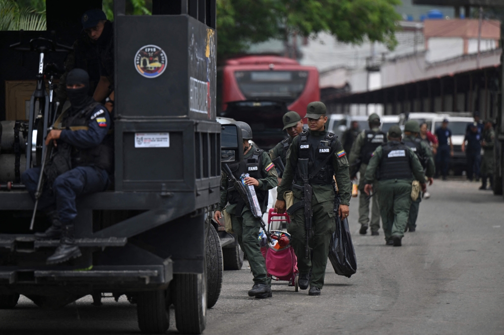 Venezuela said yesterday it had seized control of a prison from the hands of a powerful gang with international reach, in a major operation involving 11,000 members of its security forces. — AFP pic