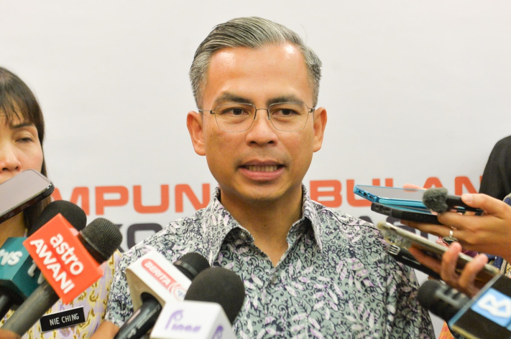 Communications and Digital Minister Fahmi Fadzil speaks during a press conference in Putrajaya on September 21, 2023. — Picture by Miera Zulyana