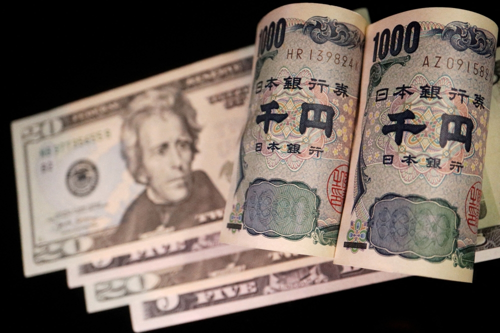 Banknotes of Japanese yen and U dollar are seen in this illustration picture taken September 23, 2022. — Reuters pic