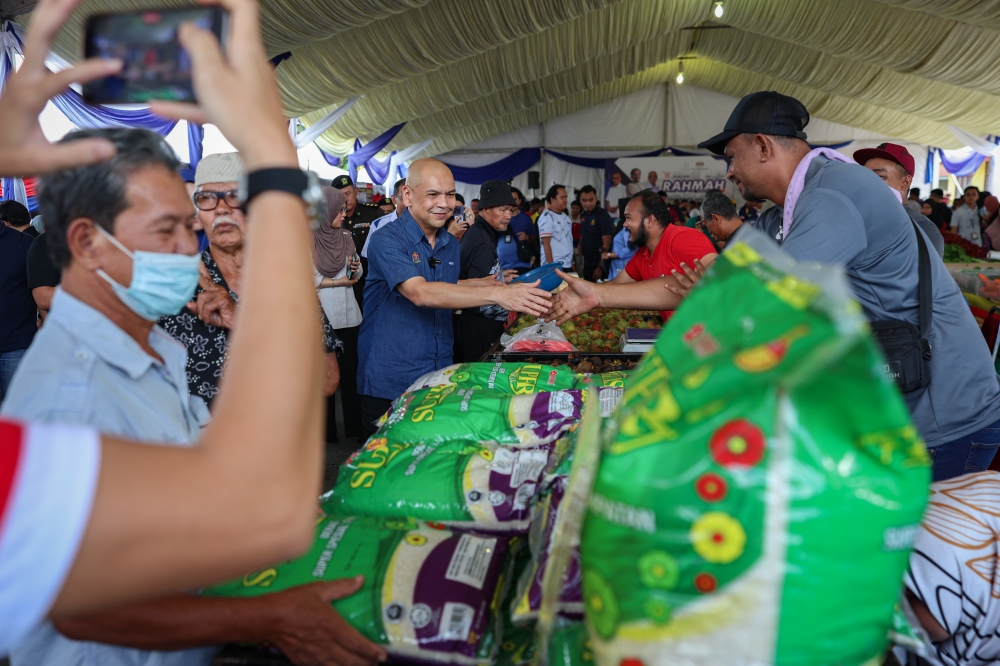 Domestic Trade and Cost of Living acting minister Datuk Armizan Mohd Ali said the decision to sell imported rice at Rahmah prices at the sales was taken to prevent the programme, which is held in all state constituencies across the country, from disrupting the supply of local rice in the market. — Bernama pic 