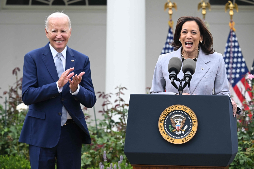 US President Joe Biden applauds as Vice President Kamala Harris speaks announcing the White House Office of Gun Violence Prevention, in the Rose Garden of the White House in Washington, DC, September 22, 2023. — AFP pic