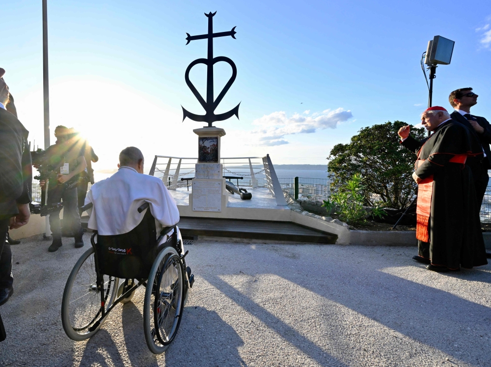 Pope Francis has a moment of reflection with migrants and religious leaders in front of the memorial dedicated to sailors and migrants lost at sea, at the Basilica of Notre-Dame de la Garde in Marseille, southern France, on September 22, 2023. — AFP pic