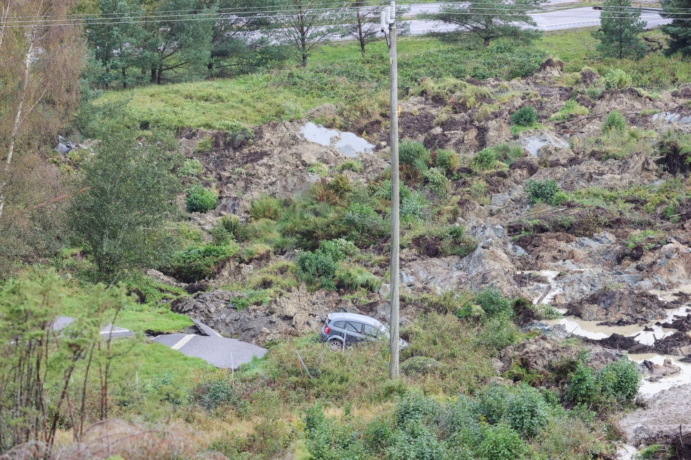A view of a car and partially collapsed motorway following a landslide, near Stenungsund, Sweden September 23, 2023. — Reuters pic