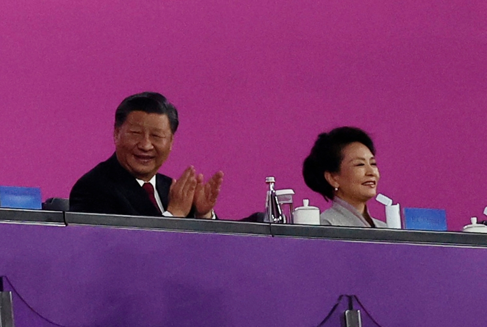 Chinese President Xi Jinping and his wife Peng Liyuan attend the Opening Ceremony at the Hangzhou Olympic Sports Centre Stadium in Hangzhou, China, September 23, 2023. — Reuters pic