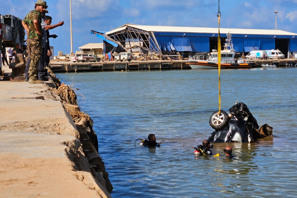 Nearly two weeks after a flash flood devastated the Libyan port city of Derna, the official death toll keeps rising, passing 3,800 yesterday. — AFP pic