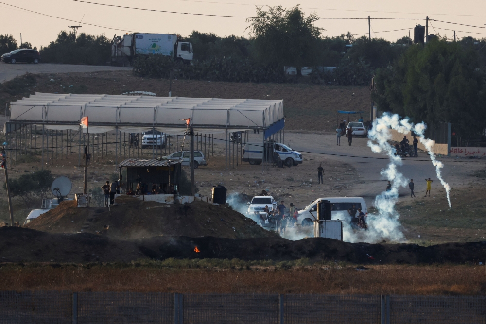 Three Palestinians were wounded in clashes along the Israel-Gaza border yesterday, Palestinian officials said, as the Israeli military said it was striking Hamas targets in Gaza in response to riots. — Reuters pic