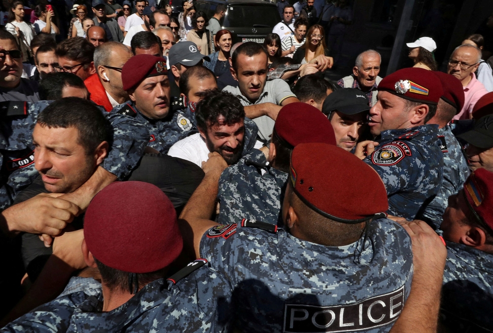 Protesters scuffle with police during a rally to demand the resignation of Armenian Prime Minister Nikol Pashinyan in Yerevan, Armenia, September 22, 2023. — Reuters pic