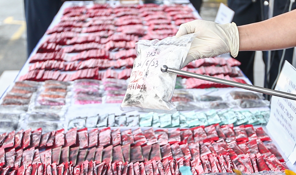 Perak police chief Datuk Seri Mohd Yusri Hassan Basri shows drugs seized from a house in Jalan Medan Ipoh during at a press conference at the Perak Police Headquarters in Ipoh in this file picture taken on June 28, 2023. — Picture by Farhan Najib