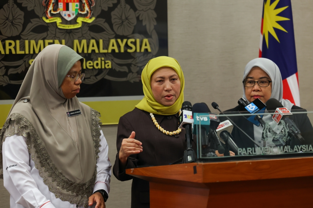 Last week, Women, Family and Community Development Minister Datuk Seri Nancy Shukri (centre) said that her ministry is discussing with the Welfare Department to make public the SOP used by welfare officers in determining whether mothers are unfit. — Bernama pic