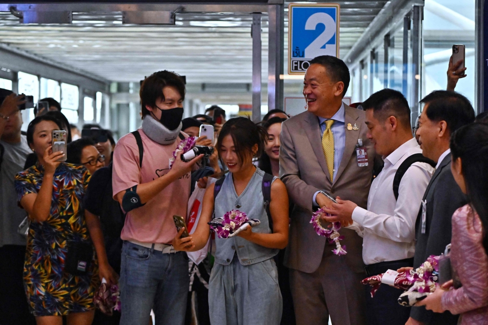 Chinese tourists landing in Bangkok got a VIP welcome today, as Prime Minister Srettha Thavisin personally greeted the first batch of visitors to arrive in Thailand after it waived visas for Chinese nationals to boost the key tourism industry. — AFP pic