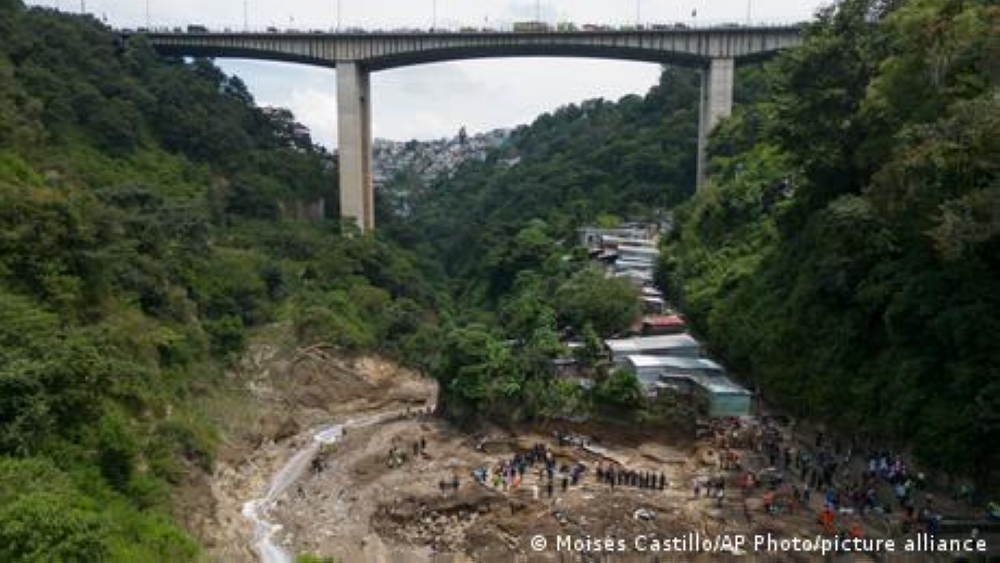 Rescuers are scrambling to find 13 missing people after heavy overnight rains caused a landslide and major damage to slum housing near a water source. The local fire department said it had found six dead bodies. ― DW pic