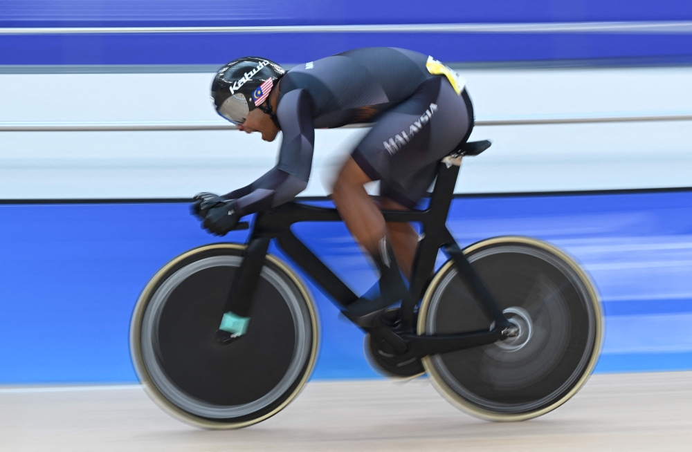 Malaysia’s Muhammad Shah Firdaus Sahrom competes in the men’s sprint 1/16 finals of the cycling track event during the 2022 Asian Games in Hangzhou in China’s eastern Zhejiang province on September 27, 2023. — AFP pic 