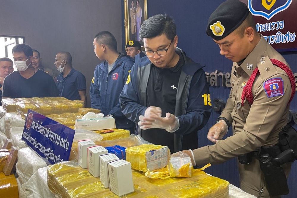 Police officers examine seized drugs worth US$8.15 million during a news conference at the Patrol and Special Operation Division in Bangkok, Thailand September 28, 2023. — Reuters pic