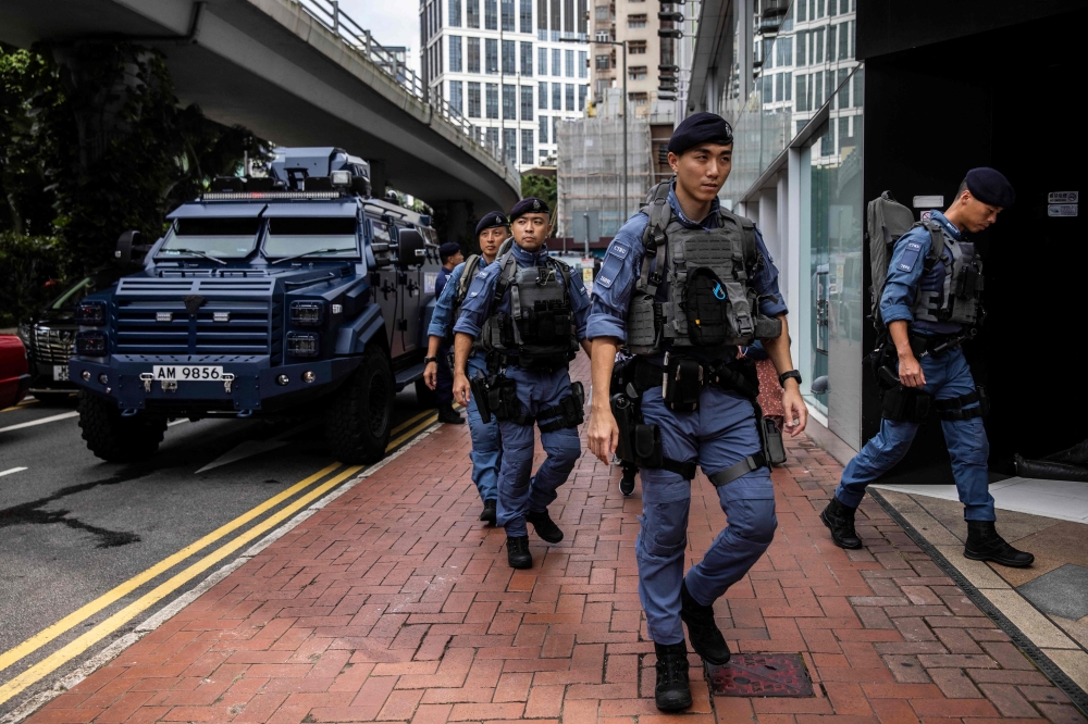 Activists say Hong Kong’s police have stepped up surveillance — pre-emptively discouraging rallies before applications are filed, paying home visits and summoning organisers for warning chats. — AFP pic
