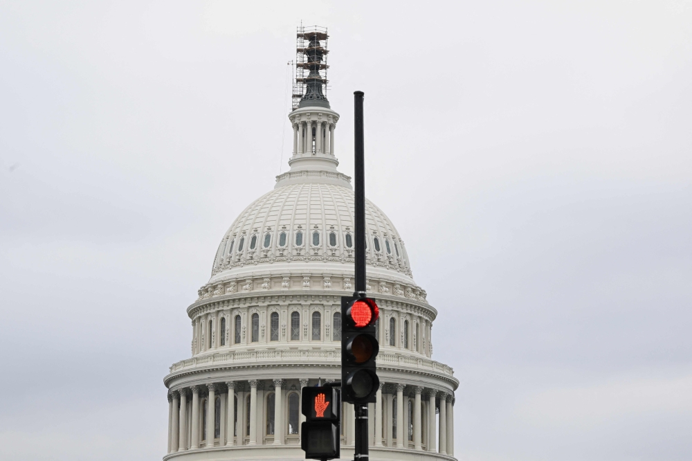 The Democratic-led US Senate forged ahead yesterday with a bipartisan stopgap funding bill aimed at averting a fourth partial government shutdown in a decade, while the House began voting on partisan Republican spending bills with no chance of becoming law. — AFP pic