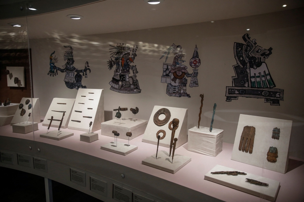 Recently excavated Aztec ritual offerings carved from wood are pictured, including chest plates, sceptres and ear flares, part of the exhibition ‘Insignia of the Gods, the wood in the Templo Mayor,’ at the Templo Mayor Museum in Mexico City September 27, 2023. — Reuters pic