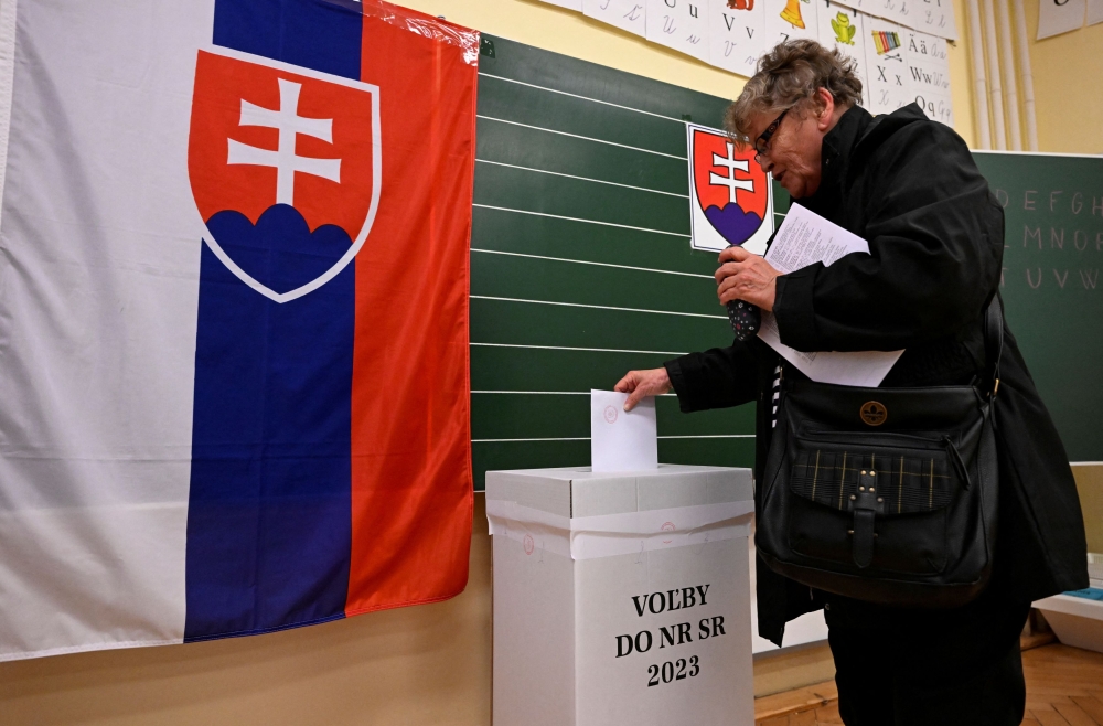 A man casts a ballot at a polling station during the country's early parliamentary election in Trencianske Stankovce, Slovakia September 30, 2023. ― Reuters pic