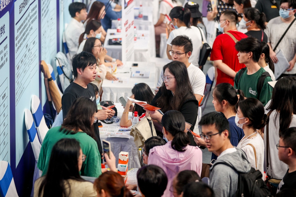 University graduates attend a job fair in Wuhan, in China’s central Hubei province on August 10, 2023. — AFP pic