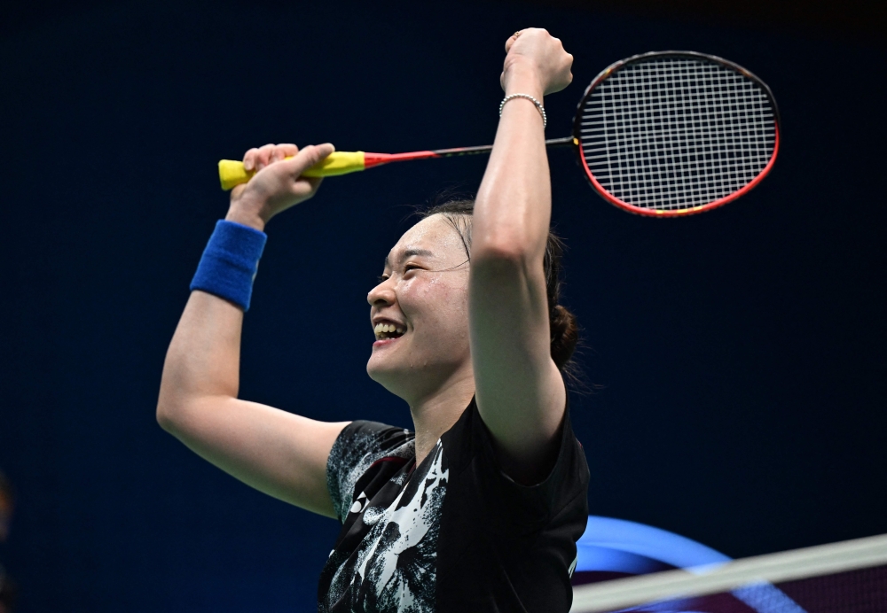 South Korea's Kim Ga-eun reacts after beating China's He Bingjiao during the women's team badminton final between China and South Korea at the 2022 Asian Games in Hangzhou in China's eastern Zhejiang province on October 1, 2023. — AFP pic
