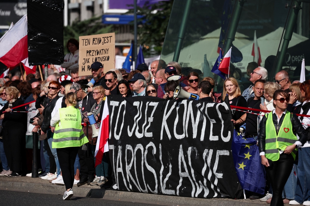 People take part in an opposition rally 'Marsz Miliona Serc', two weeks ahead of the parliamentary election, in Warsaw, Poland, October 1, 2023. The banner reads: 'This is the end, Jaroslaw'. — Reuters pic