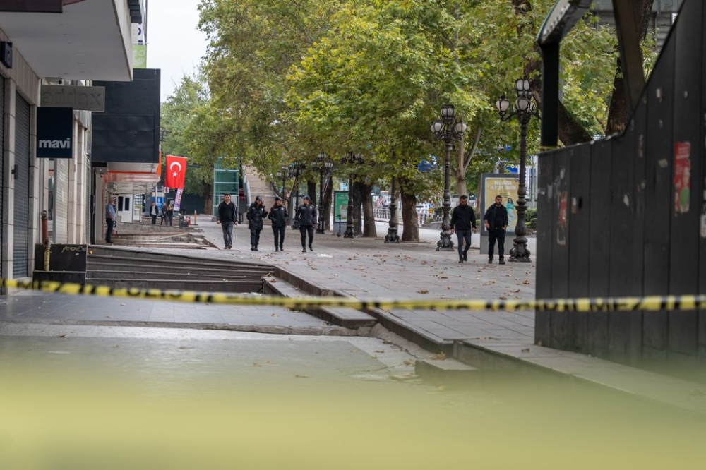 A group of police officers stand guard in front of the Ministry of Internal Affairs, where the bomb attack took place. At around 9am in Turkey's capital Ankara, two members of the Kurdistan Workers' Party (PKK) carried out a bomb attack in front of the Ministry of Internal Affairs. While one of the attackers died due to a bomb, the other was neutralised by security forces. — SOPA Images via Reuters