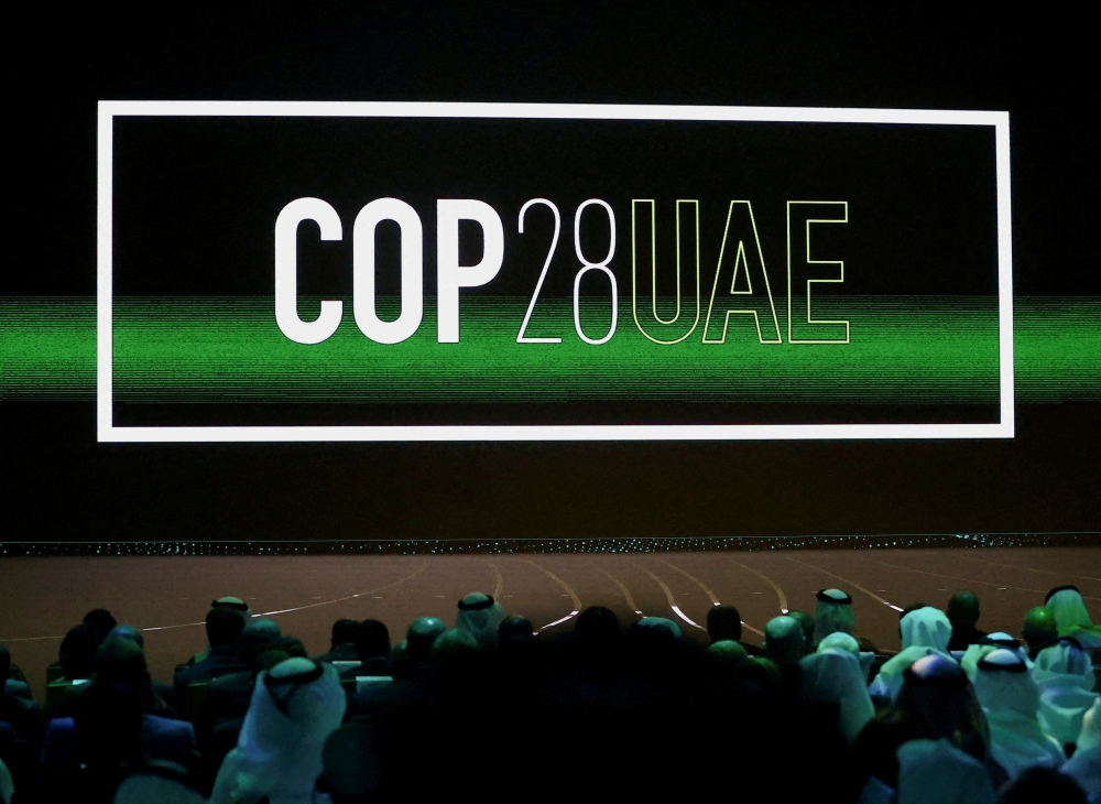 ‘Cop28 UAE’ logo is displayed on the screen during the opening ceremony of Abu Dhabi Sustainability Week (ADSW) under the theme of ‘United on Climate Action Toward COP28’, in Abu Dhabi January 16, 2023. — Reuters pic