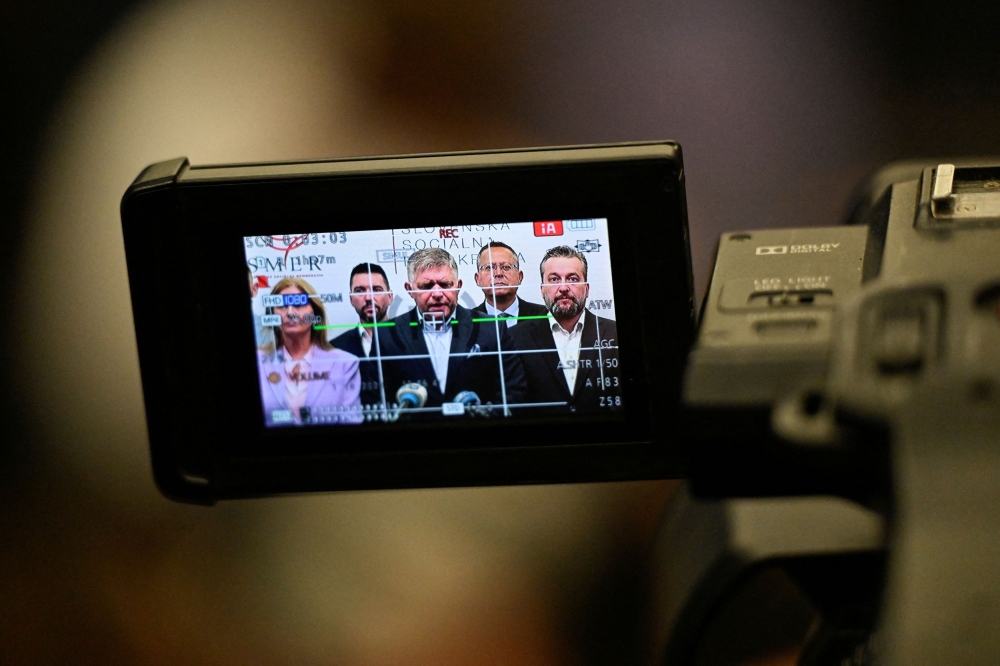 SMER-SSD party leader Robert Fico is seen on a screen as he speaks during a press conference after the country's early parliamentary elections, in Bratislava, Slovakia, October 1, 2023. — Reuters pic